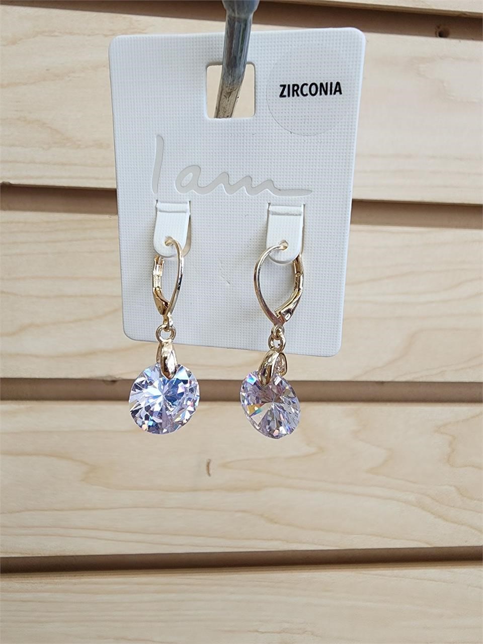 Gold tone dangle zirconia earrings