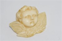 Vintage ivory carved cherub brooch