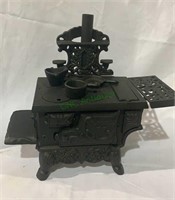 Vintage toy cast-iron kitchen stove, with iron