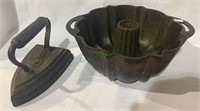 Antique cast-iron Bundt pan with a 6 pound iron