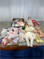 Large lot of dolls and doll clothes, some are