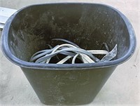 Small trashcan with miscellaneous electric cords