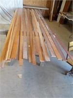 Assortment of stained wood molding and boards