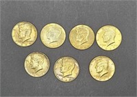 7 gold plated Kennedy half dollars