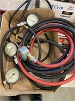 Pressure gauges and hoses, the black one is a fuel