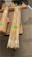 Pile of 5/16 x 48 in. Wooden Dowels
