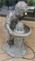 Resin Boy Drinking from Water Fountain with Pump.