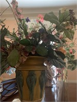 Floral arrangement in urn with blue birds, symbol