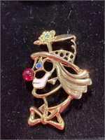 Gold tone clown pin. Measures 2 1/4 inches tall