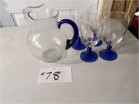 clear/blue pitcher and 4 glasses