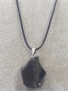 Black stone pendant with leather necklace