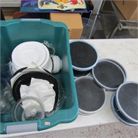 Tote of dishes, lazy Susan's and shelves.