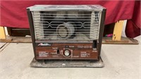 Vintage kerosene heater. Measures 23x9x18 inches