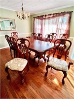 Beautiful carved table 10 chairs & leaf