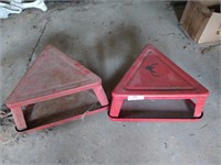 Two metal rolling shop stools