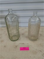 Two decorative thick glass bottles Hooper s