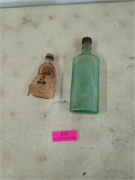 Two old medicine bottles