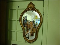 Serpentine gilt wall mirror