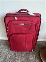 Red Ricardo Suitcase