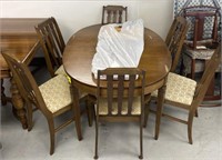 Dining table with upholstered cushion chairs and