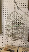 Wire candle holder made to look like a birdcage