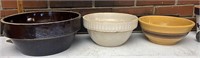 Three stoneware bowls all cracked