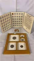 Framed coins and collectors book