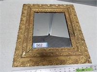 Wall mirror in an antique frame;  approx 17" x 19