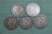 5 US Morgan silver dollars: 1879 S, 1887 O, 1891 O
