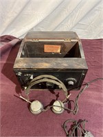Vintage radio with scientific navy type headphones