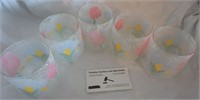 frosted glasses w/ flower designs to hold candles