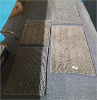 Two sets of new bathroom rugs