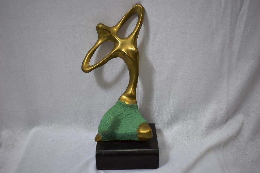 A Modern Brass Statue on Wood Block