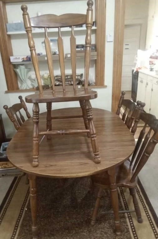 59" LONG TABLE & 4 CHAIRS
IT HAS A 18" LEAF SO