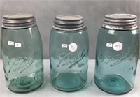 3 blue ball mason jars with bubbles