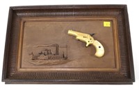 Colt Derringer .22 Short mounted on framed,