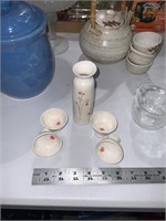 delicate pottery vase and small bowls