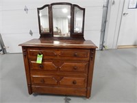 Antique dresser with fold in mirror; missing a cas