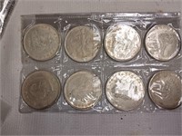 Eight Silver Toned Tokens