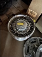 (4) Cadillac hubcaps