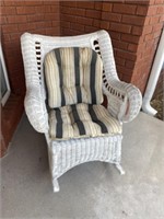 White wicker rocking chair. Used on front porch