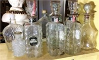 Selection of 10 Decanters & bottles Tallest is