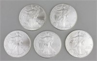 5 2010 One Ounce Fine Silver Eagles.