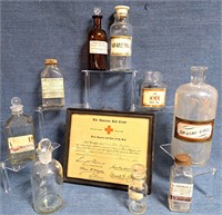 GLASS PHARMACY MEDICINE BOTTLES & RED CROSS SIGN