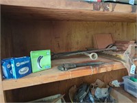 Shelf contents w lug wrench, pipe wrench, etc