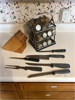Glass spice jars, knives and block