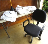 Office chair, towels, toilet plunger