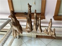 Four wooden pieces of driftwood
