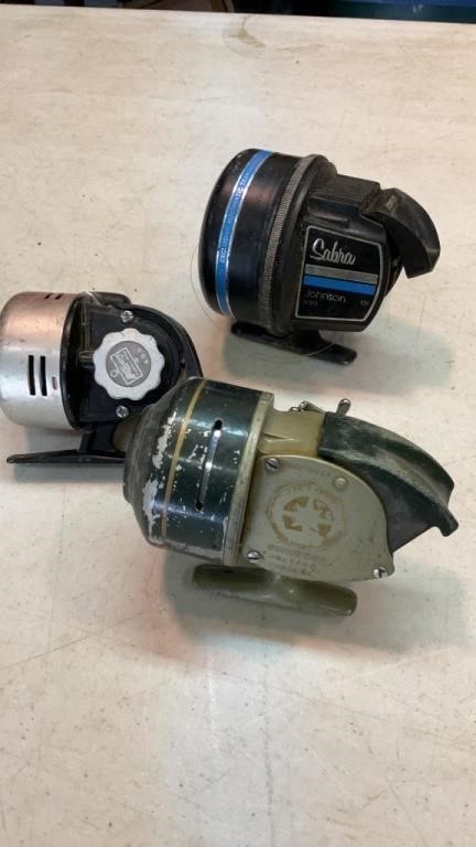 Three fishing reels