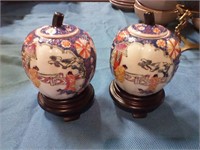 Oriental ginger jars on wood base